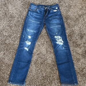 Levi's dark blue denim jeans with tan stitching